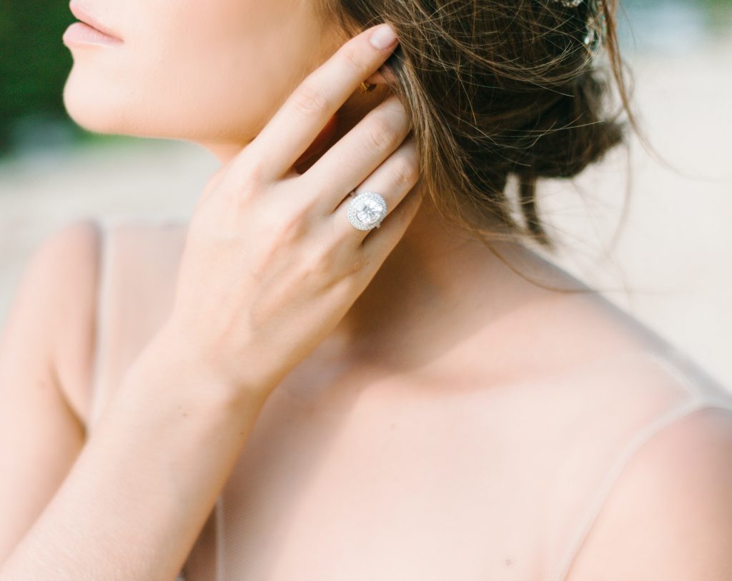 woman wearing diamond ring