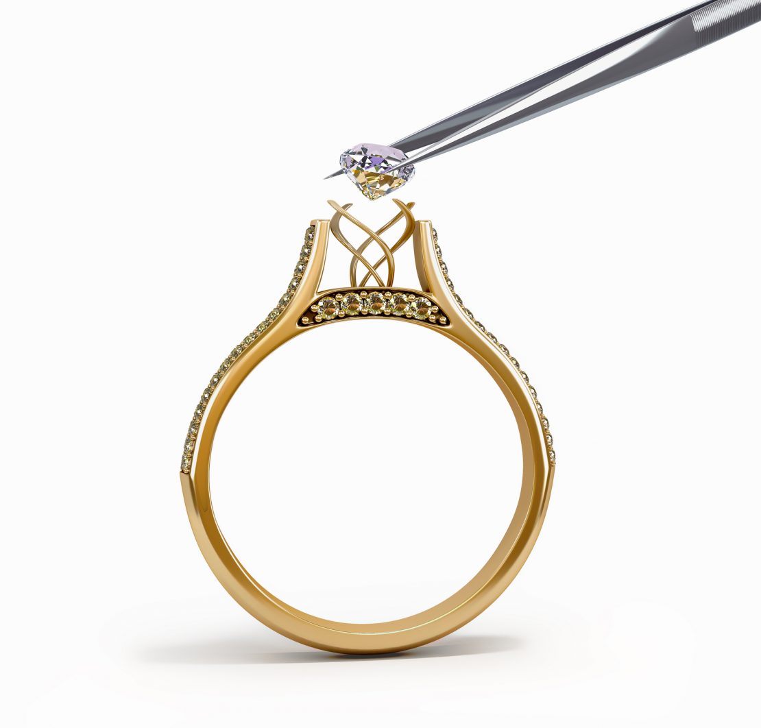 tweezers inserts diamond into ring
